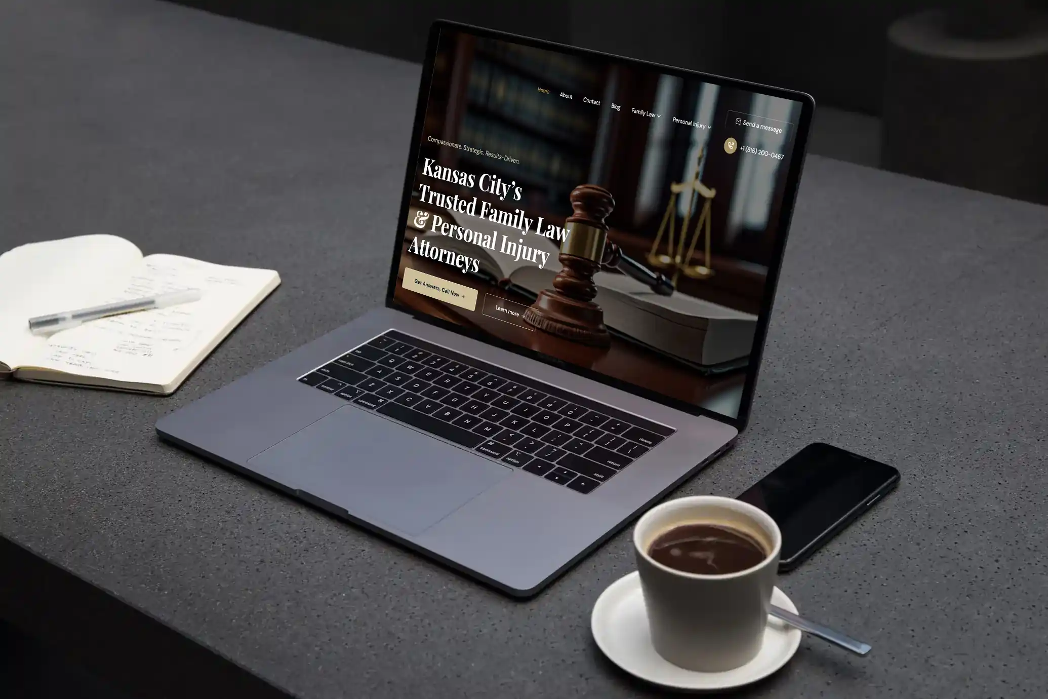 A laptop displaying the contents of the MorenoLawKC website.